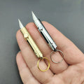 Mini cuchillo retractil de laton – Detalle y presentación – NQLN Store Venezuela