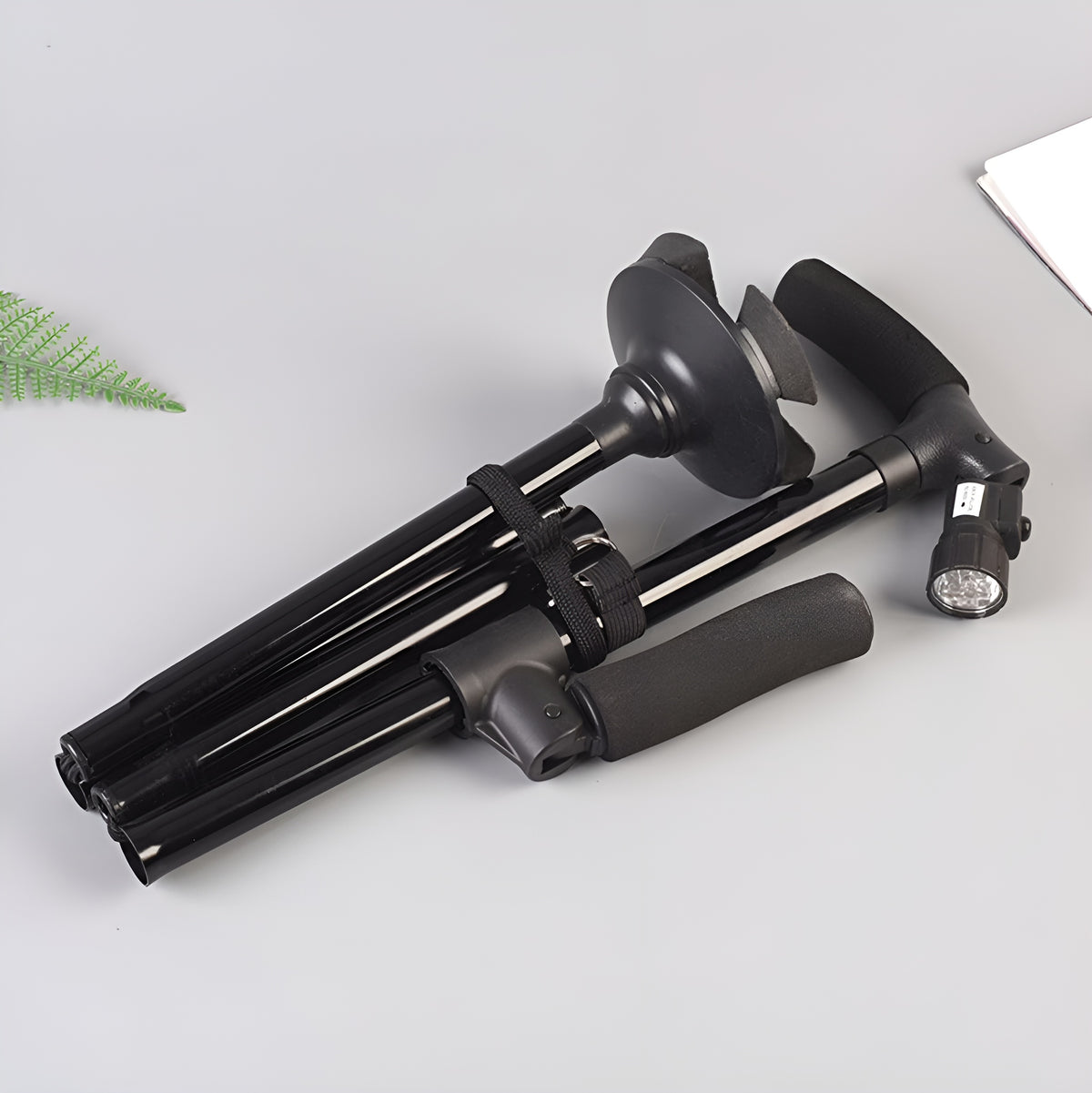 Baston plegable portatil con linterna